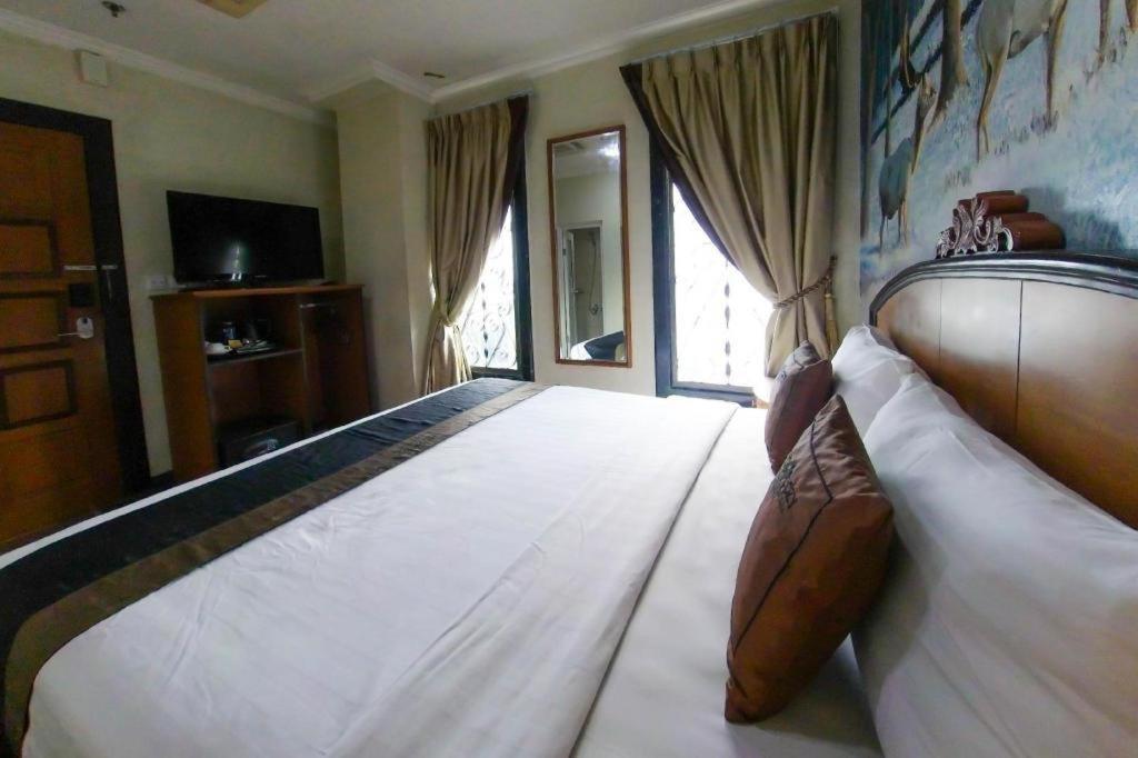 Amos Cozy Hotel Melawai Jakarta Eksteriør bilde